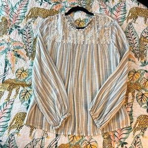 Long sleeve cream colored top with stitched front